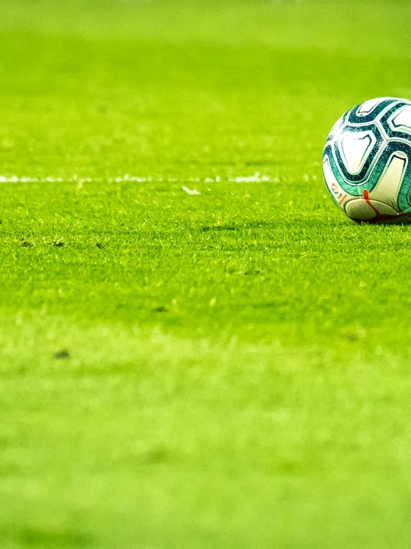 A football at a player’s feet